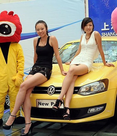 Two Chines Girls and a new Volkswagen Polo