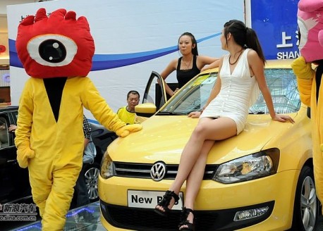 Two Chines Girls and a new Volkswagen Polo