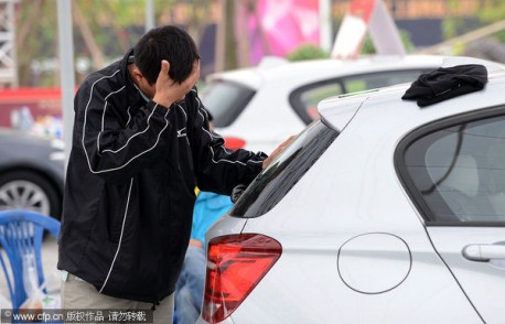 Chinese man wins BMW 1-series by Touching it for 87 hours