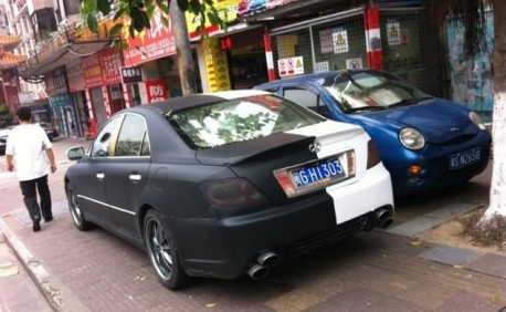 Toyota Reiz in matte-black, and white