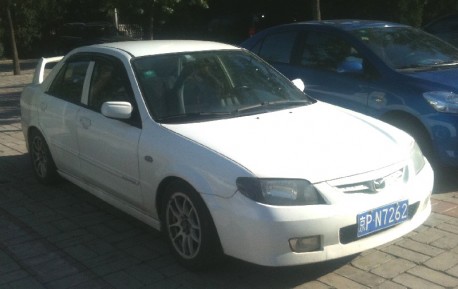 Mazda Familia with a Big Wing in China