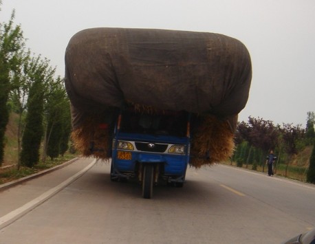 A slightly overloaded motorized tricycle in China