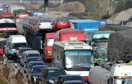 Sixteen cars on top of a Truck in China