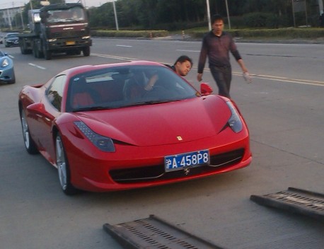 Another truck full of Ferrari supercars in China