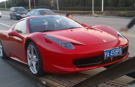 Another truck full of Ferrari supercars in China