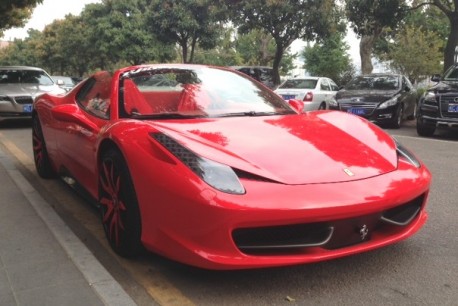 Ferrari 458 Spider is Red with a bit of Pink in China