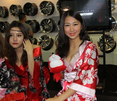 Girls get Bored at the Auto Show in China