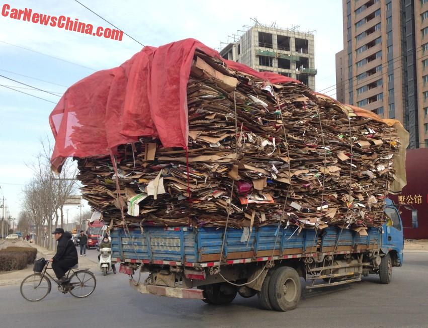 Video of overloaded truck teetering past pedestrians with inches to spare  in China